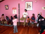 Vrsksasana with kids against walls